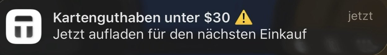 A notification banner in German reading 'Kartenguthaben unter $30' with a warning icon, subtitled 'Jetzt aufladen für den nächsten Einkauf' and a 'jetzt' button.