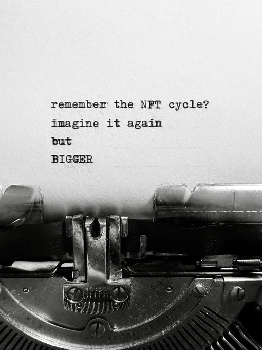 A black-and-white image of a typewriter with the typed text 'remember the NFT cycle? imagine it again but BIGGER'.