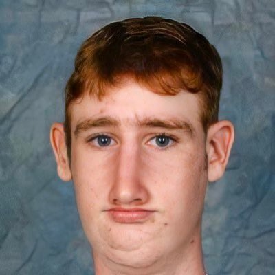 A young man with reddish-brown hair and blue eyes looks directly at the camera with a neutral expression against a grayish-blue backdrop. The image appears to be a "before" photo of someone, presumably @greg16676935420, depicting his appearance prior to entering the crypto world.