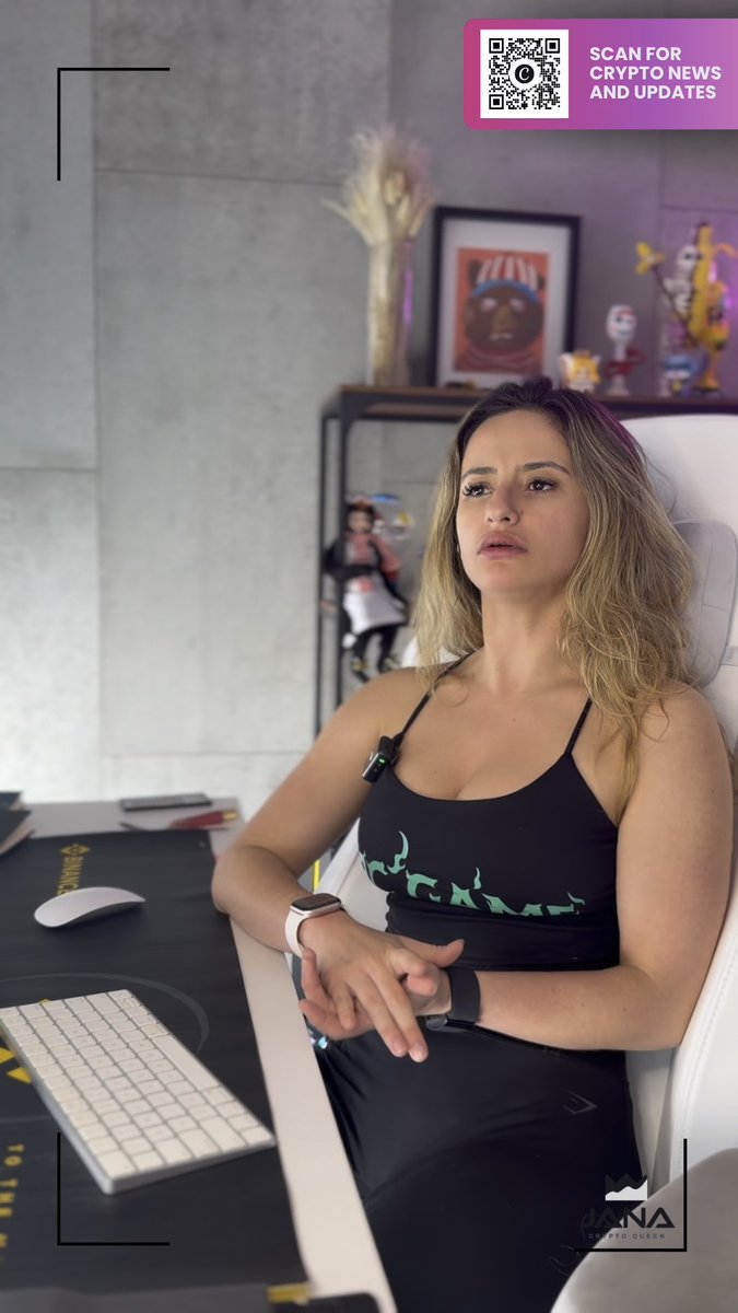 A woman in a black sports bra and leggings sits at a gaming setup with a keyboard and mouse, looking at the camera; the image includes a QR code overlay labeled "SCAN FOR CRYPTO NEWS AND UPDATES" and a watermark for "JANKA CRYPTO QUEEN."