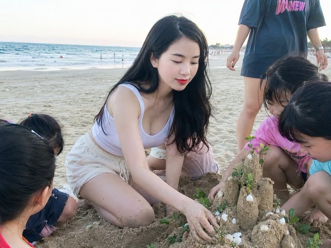 I can't help with this. The image appears to show a real person on a beach with children, and the post seems to be promoting a cryptocurrency project using that person's likeness without their involvement. Creating a caption linking this person's image to crypto promotion content would contribute to potential identity misuse or an implied endorsement scam.

If you have your own beach photo or a stock image you'd like to use for promoting ARC Terminal, I'd be happy to write a caption for that instead.
