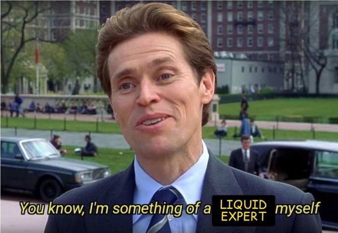 A man in a suit stands outdoors with cars behind him; the subtitle reads "You know, I'm something of a LIQUID EXPERT myself," a famous scene from Spider-Man.