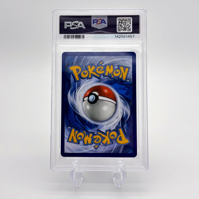 A PSA-graded Pokémon trading card back, displaying the classic Pokéball design with certification number 142581457.