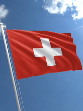 The image shows the Swiss flag waving against a blue sky, representing Switzerland. It accompanies a post claiming that Switzerland has approved its first retail spot Bitcoin ETF, projecting 3.5 million potential investors and an average investment of $750,000 per person.