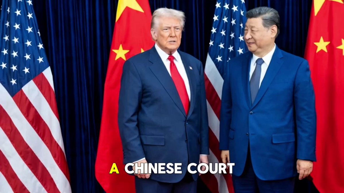 The image features two men dressed in suits, standing next to each other with their hands together. They appear to be posing for a photo or attending an event related to Chinese court rulings. The background of the image includes several American flags, which suggests that this gathering might be taking place at an official event or ceremony.