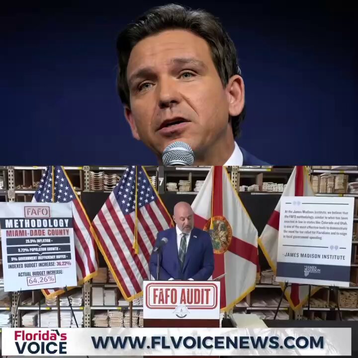 The image shows a man standing at a podium with a microphone, giving a speech or presentation. The background of the image features multiple flags, including an American flag and a Florida Flag. There are also several books scattered around the scene, possibly related to the topic being discussed by the speaker.