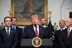 This image shows Donald Trump at a podium in the Oval Office, surrounded by other men, likely in a formal setting. The post's reference to "settlement" and the "Oval Office" suggests this image is being used metaphorically to imply a significant agreement or resolution has occurred, potentially related to the SEC and XRP.