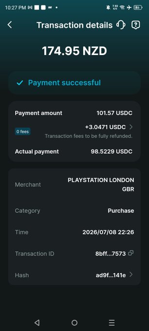 A screenshot of a mobile phone displaying a successful transaction of 174.95 NZD (101.57 USDC) made at 'PLAYSTATION LONDON GBR' on 2026/07/08, with a zero-fee note.