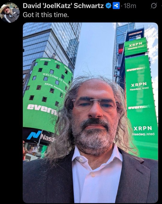 A selfie by David 'JoelKatz' Schwartz in front of large green Nasdaq billboards advertising 'XRPN Nasdaq Listed' and 'everse' in Times Square.