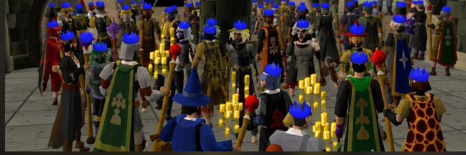 A crowd of blue-crowned characters gathers in a stone courtyard, with the Moby logo overlaid on their attire in connection with the $BLUE Solana token launch.