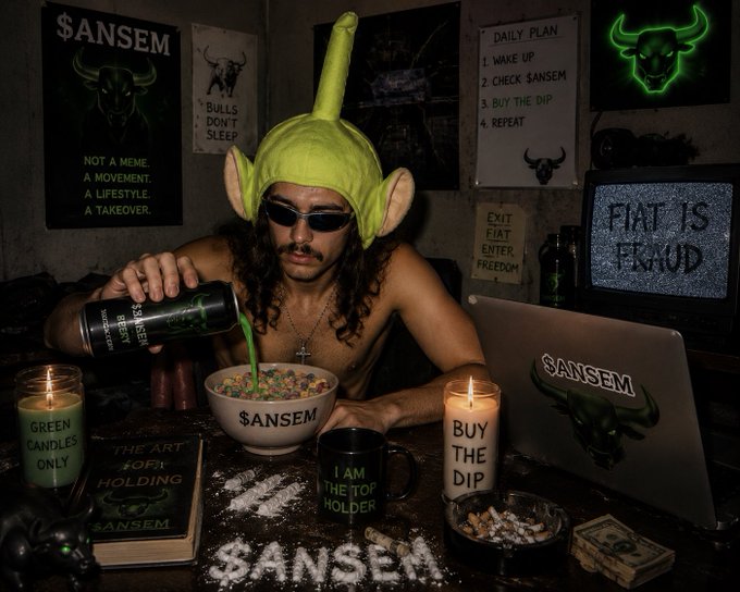 A man wearing a green goblin-style hat and sunglasses pours green liquid from a '$ANSEM' shaker into a matching bowl of cereal, surrounded by '$ANSEM' and 'BUY THE DIP' branding.