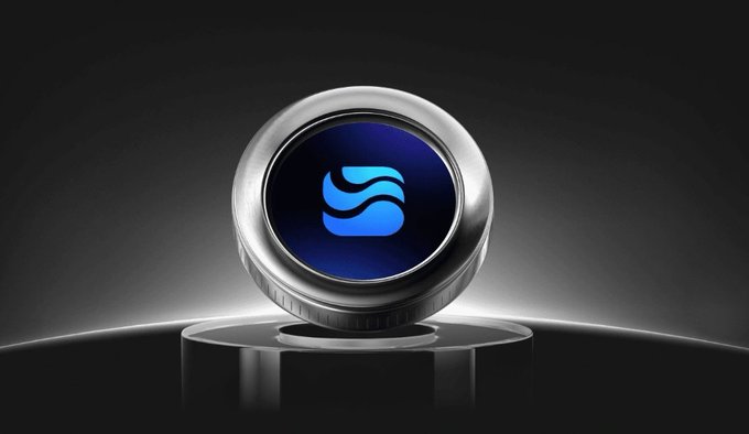 The image features a silver button with a blue logo that says "River" on it. The button is placed against a black background, which makes it stand out prominently. The caption below the button reads "Happy weekend fam If you’ve been watching from the sidelines, Season 5 on @River4fun feels like a great time to get involved WeThe creator program is active, the community is growing, and $RIVER continues attracting more attention each week Spent part of my morning". The image seems to be related to the post about River4Fun, as it highlights the importance of the river in their lives.