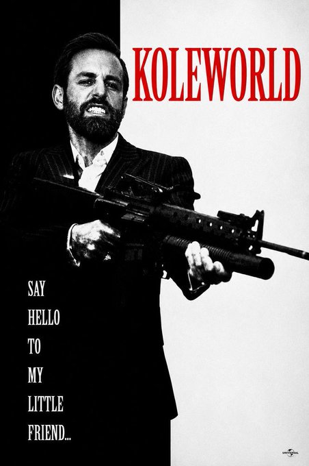 A stylized movie poster-style image features a bearded man in a pinstripe suit wielding a rifle, with the text "KOLEWORLD" in bold red letters and "SAY HELLO TO MY LITTLE FRIEND..." along the side—a Scarface reference. The imagery evokes dramatic confrontation and power, fitting the post's theme of bullish conviction clashing against bearish resistance on the path to an all-time high (ATH).