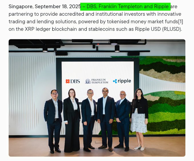 DBS, Franklin Templeton, and Ripple executives pose together at a Singapore partnership announcement on September 18, 2025, standing beneath a backdrop displaying all three company logos as they unveil tokenized money market funds and RLUSD stablecoin trading solutions on the XRP Ledger.