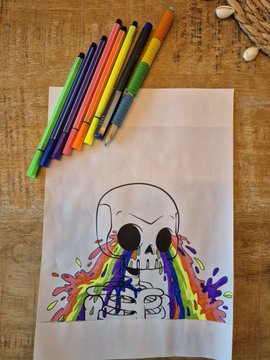 This is a child's art project with a colorfully decorated skull that appears to be melting with rainbow colors.  The art supplies used to create the masterpiece are pictured at the top of the page.