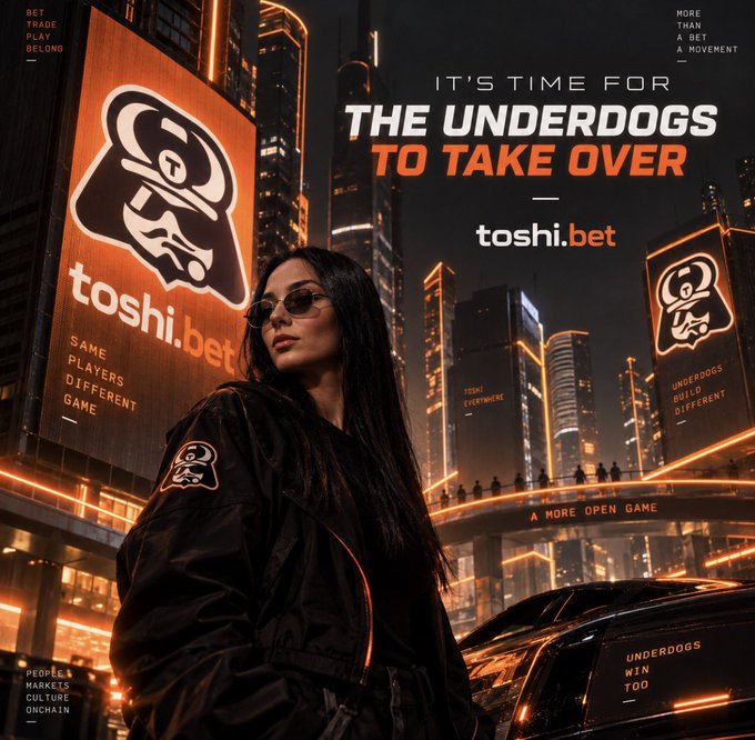 A promotional graphic for "toshi.bet" with the headline "IT'S TIME FOR THE UNDERDOGS TO TAKE OVER," showing a woman with sunglasses in a cyberpunk cityscape with orange-lit billboards displaying the toshi.bet logo.