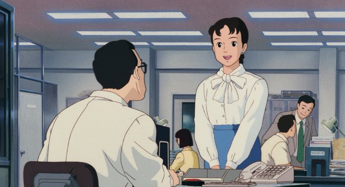 The image shows an office scene with two people sitting at desks, one of whom appears to be a woman wearing a white shirt and blue skirt. The other person seems to be a man dressed in a suit. They are both looking at each other while seated at their respective desks. In the background, there is another person who might also be an employee or colleague.

The image includes text that reads "Bitcoin's dropping in value, huh!" and "Focus on what is in the image and how it relates to the post". This suggests that the office environment may be related to a discussion about Bitcoin or cryptocurrency, possibly as part of a broader conversation about financial trends or market speculation.