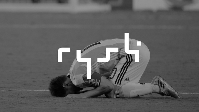 Black and white image of a soccer player (appearing to be Cristiano Ronaldo) kneeling on the field with face down, overlaid with the 'rush' logo.