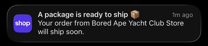 A mobile notification from the 'shop' app reads: 'A package is ready to ship 📦 Your order from Bored Ape Yacht Club Store will ship soon.'