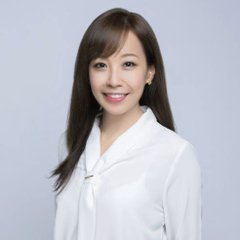 A professional headshot of Catherine Chen, Binance's Head of VIP & Institutional, wearing a white blouse and smiling at the camera. The image accompanies an article in which she discusses the growing interest among hedge funds in trading traditional financial instruments on Binance due to arbitrage opportunities from 24/7 trading and weekend price discovery.