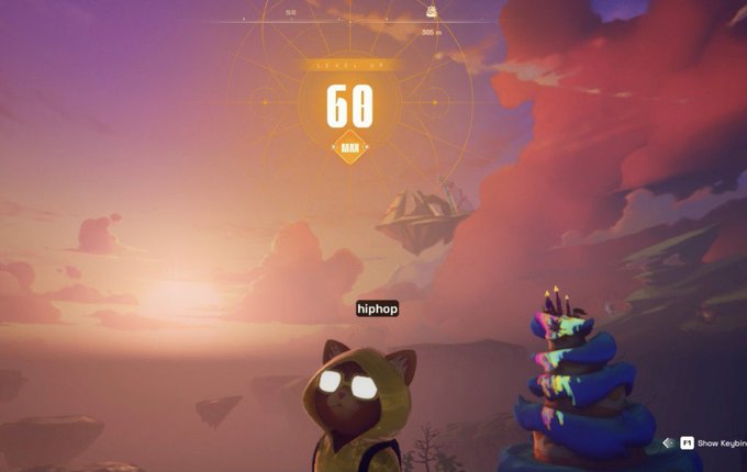 The image shows a character wearing a hoodie, standing next to a cake with a cat sitting nearby. A score of 60 is displayed at the top left corner of the screen, indicating that the player has achieved the maximum level in the game. The background features a sunset and clouds, creating an atmospheric setting for the gaming experience.
