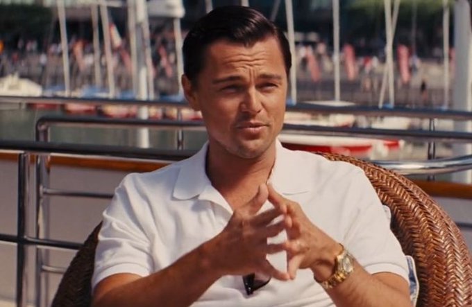 A man in a white polo shirt sits on a yacht with sailboats in the background, gesturing thoughtfully with his hands while wearing a gold watch. 

The image's luxurious yacht setting and affluent atmosphere humorously contrast with the post's discussion about crypto/X account management, suggesting the lavish lifestyle that can come with successful crypto ventures—often the unspoken motivation behind running multiple accounts or working with marketing agencies.