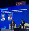 Two speakers discuss XRP at a Crypto.com panel on cross-border payments and institutional adoption. The image ties to the post’s claim that XRP rejected $1.45, swept liquidity to $1.3448, and may reclaim the $1.40 flip level before its next move.