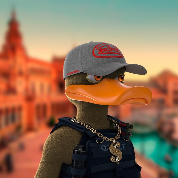 3D-rendered anthropomorphic duck character wearing a grey cap with red embroidery, a gold chain, and tactical vest, posed against a blurred architectural background.