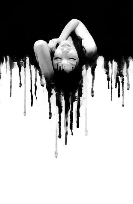 A black and white artistic photograph of a woman with her head tilted back, merged with dripping black paint that flows downward across the white background.