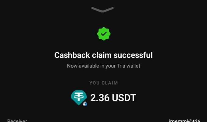 A confirmation screen displays "Cashback claim successful" with the message "Now available in your Tria wallet," showing a claimed reward of "2.36 USDT" alongside the Tether (USDT) logo. The image illustrates the final step of the cashback redemption process mentioned in the post, confirming that the user successfully claimed their TRIA card cashback reward.