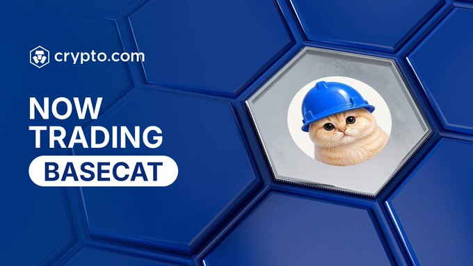 Crypto.com announces that BASECAT is now trading on their platform, featuring a cat mascot wearing a blue hard hat against a blue honeycomb background, aligning with the post's excitement about the token gaining more exchange listings and potential for price breakout above $28M market cap.