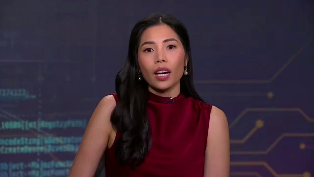The image features a woman wearing a red top, with a logo or graphic in the bottom right corner of the frame. She appears to be talking about Bitcoin while showing signs of exhaustion, indicating that she has been discussing this topic for an extended period. The text reads "BLOOMBERG just dropped a bombshell has reportedly been accumulating bitcoind for years & now holds ~$1.3 BILLION in BTC without selling a single sat." This quote suggests that the woman might be referring to the story of someone who accumulated Bitcoin over time, without ever selling any of it. The overall mood seems somewhat negative or disheartening, as indicated by her tired appearance and the fact that she has been working on this topic for a long time.