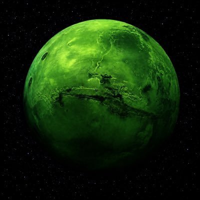 A green-colored planet or moon with a face-like surface resembling an angry expression, set against a starry black space background.