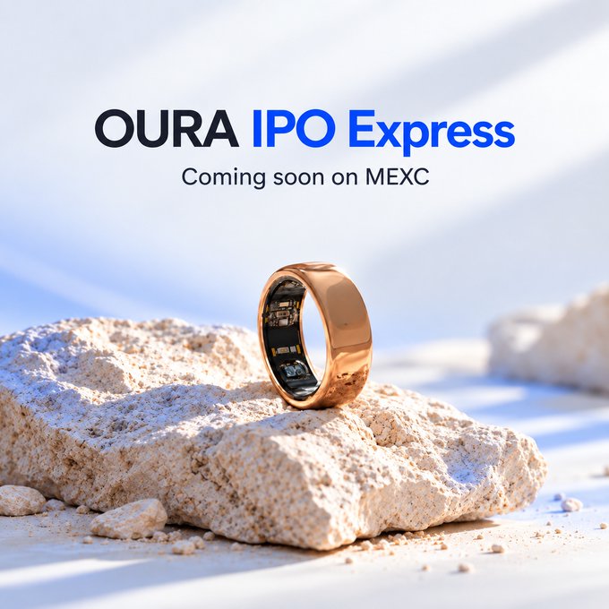 A gold Oura smart ring rests on a white rock against a soft, pale background, with promotional text reading "OURA IPO Express — Coming soon on MEXC," highlighting the brand's upcoming public offering launch on the MEXC exchange.