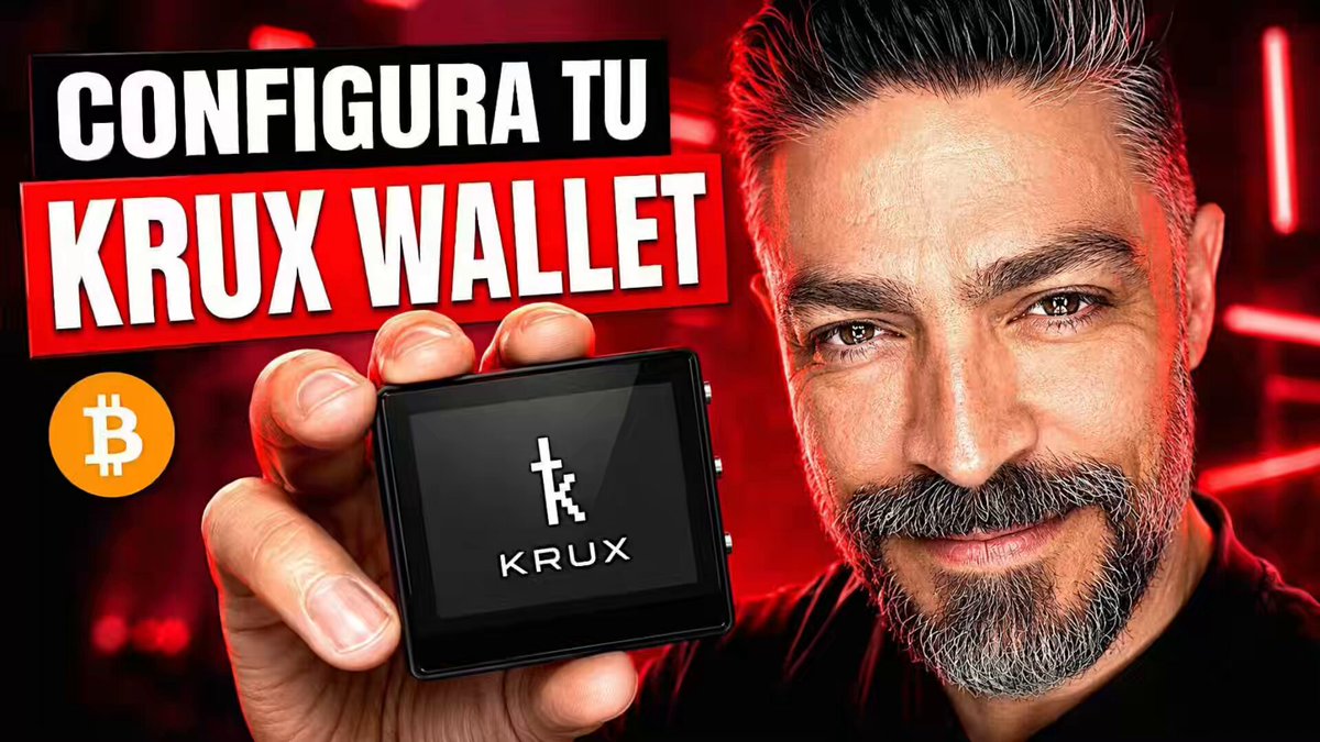 The image features a man holding a small black device with a white logo that says "KRUX" on it. The man appears to be smiling while showing off his new item. The background of the image has red neon lights, which adds a vibrant touch to the scene. The text in the image reads "CONFIGURA TU KRUX WALLET", indicating that the device is related to Bitcoin and cryptocurrency wallets.