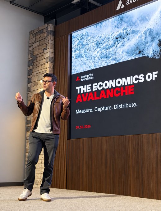 Matias, wearing a brown leather jacket and glasses, speaks energetically onstage with raised fists at the Avalanche Foundation event titled "THE ECONOMICS OF AVALANCHE – Measure. Capture. Distribute." dated 09.16.2026, directly illustrating the post's description of him presenting as Chief Investment Officer on Avalanche's economic model.
