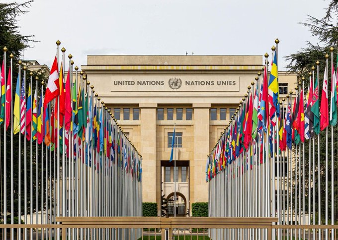 The United Nations building is adorned with the flags of member nations, symbolizing its global reach. The post highlights the UN's expanded blockchain payments agreement with Stellar ($XLM), showcasing Stellar's utility in facilitating critical financial transactions.