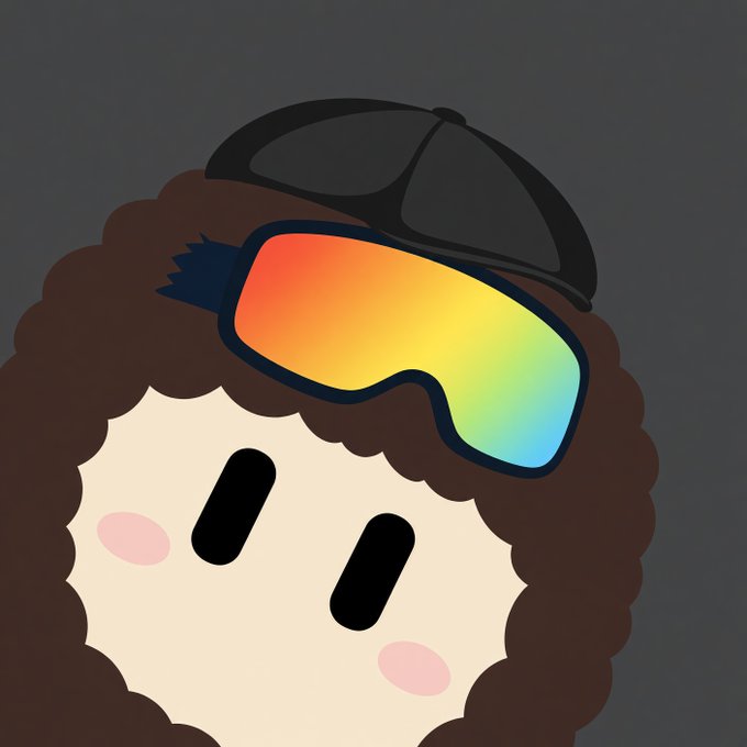 A cute cartoon character with brown curly hair, a black cap, and rainbow-colored ski goggles, featuring pink blushing cheeks against a gray background.