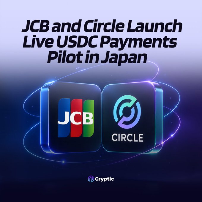 A promotional graphic announcing "JCB and Circle Launch Live USDC Payments Pilot in Japan," featuring the JCB and Circle logos side by side on glowing dark blue tiles, with a "Cryptic" watermark at the bottom—visually tying together the two companies partnering on the stablecoin payment initiative described in the post.