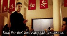 A scene featuring a man in a black shirt in a restaurant with Chinese characters on red banners in the background, with overlaid text reading 'Drop the 'the'. Just Facebook, it's cleaner.'