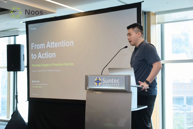 A man delivers a presentation titled 'From Attention to Action: The Next Chapter of Prediction Markets' at a Fortune branded event held at Suntec Singapore.