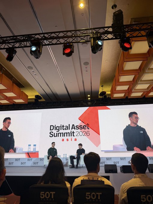 A conference panel at the 'Digital Asset Summit 2026 asia' showing speakers on stage with 'SOT FUNDS' branding, featuring large screens displaying the speakers.