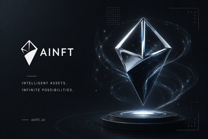 The image is a promotional graphic for AINFT, featuring a glowing crystalline octahedron hovering above a circular platform, with the tagline "INTELLIGENT ASSETS. INFINITE POSSIBILITIES." and the website "ainft.io" displayed alongside the AINFT logo. The futuristic, tech-inspired design visually reinforces the post's concept of merging artificial intelligence with blockchain-based digital ownership (NFTs).