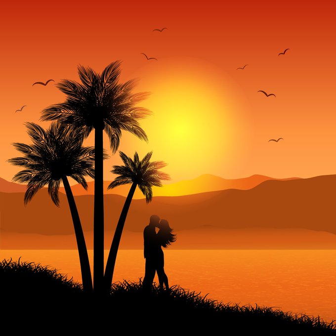 The image features a couple standing under palm trees by a body of water at sunset. They are facing each other as they share an intimate moment, possibly kissing or embracing. The scene captures the beauty of nature and the warmth of their relationship against the backdrop of the setting sun.