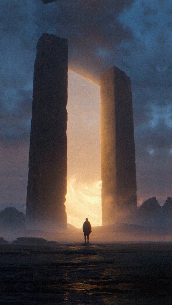 The image depicts an intriguing scene of two stone towers, possibly massive pillars or monoliths, standing next to each other against a backdrop of a dark sky filled with clouds at night. A solitary figure can be seen walking in front of these towering structures on what appears to be a rocky terrain. The post related to this image is promoting a website called @bitpandaCard for buying and selling Bitcoins. The person walking seems to be the main subject, but not directly connected to the Bitcoin-related content displayed on the post.