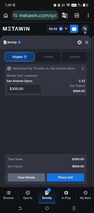 The image shows a phone screen displaying a sports betting app, likely used for online betting. The main focus of the image is a sports betting app that has a list of sports events and their respective scores displayed. There are two sports featured on the screen - Oklahoma City Thunder vs. San Antonio Spurs. The app also provides information about the total amount spent by the user and the current bet placed, as well as the remaining balance in the account.