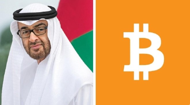 A man wearing traditional UAE attire stands beside a large orange Bitcoin logo, visually representing the country's growing commitment to cryptocurrency education mentioned in the post about bringing Bitcoin and blockchain learning into classrooms across the UAE.