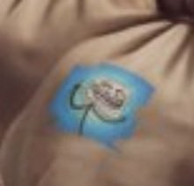 A blurry close-up of a troll doll's face, showing its signature wild hair and wide grin on a small blue body, fitting the $troll reference.