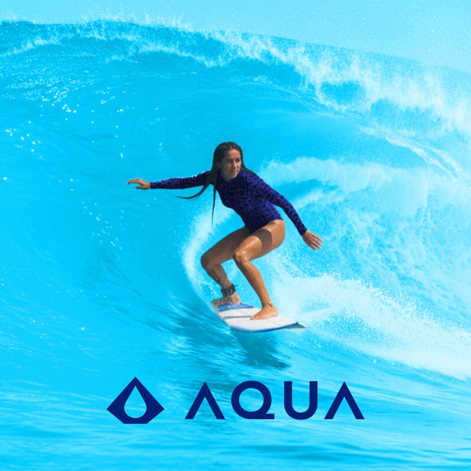 A surfer rides inside the barrel of a turquoise wave. The logo 'AQUA' with a water drop symbol is displayed at the bottom.
