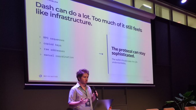 A man delivers a presentation with a slide reading 'Dash can do a lot. Too much of it still feels like infrastructure,' listing issues like RPC sequences and manual coordination.